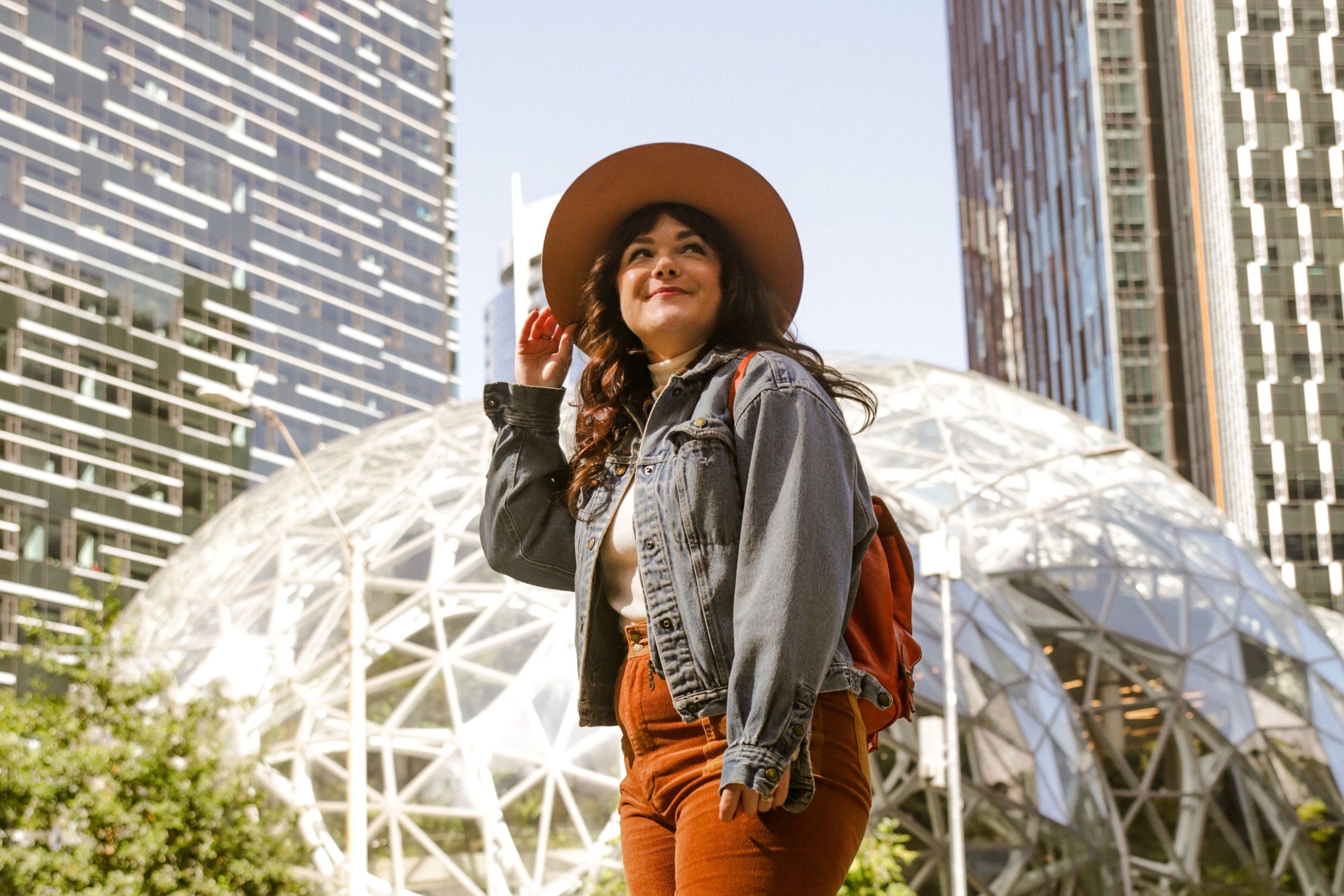 Woman exploring downtown Seattle near Amazon Spheres in Belltown neighborhood