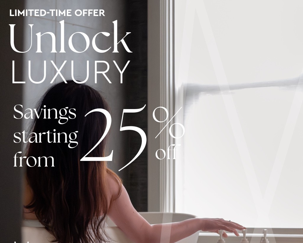Woman relaxing in a freestanding soaking tub by a window at Hotel Ändra Seattle, an MGallery boutique hotel — Unlock Luxury offer with savings starting from 25% off